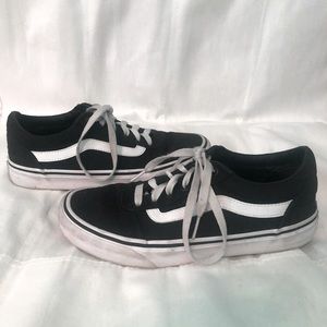 Women’s black and white Vans